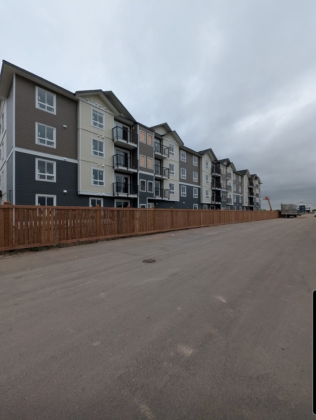 Bravo Builders — Cedar perimeter fencing on a multi-residential project