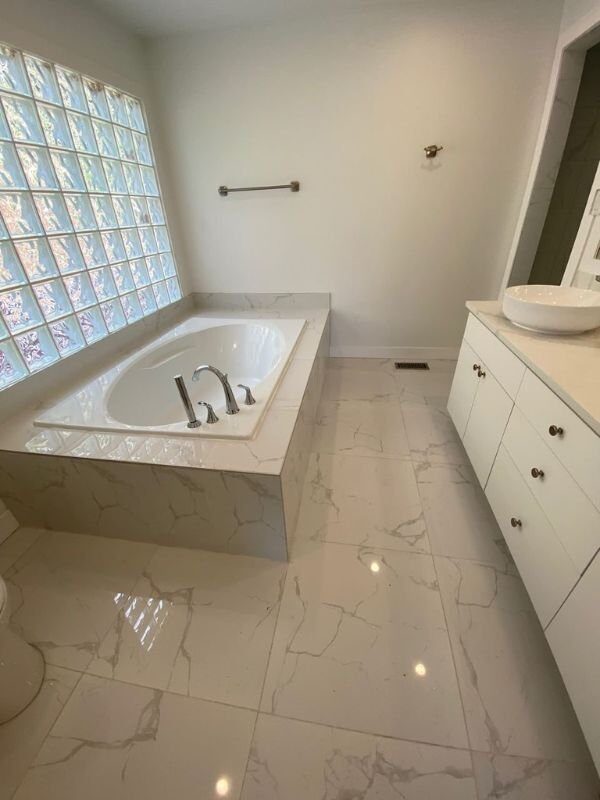 Coastal Eco Construction Corp. — Tiled bathroom