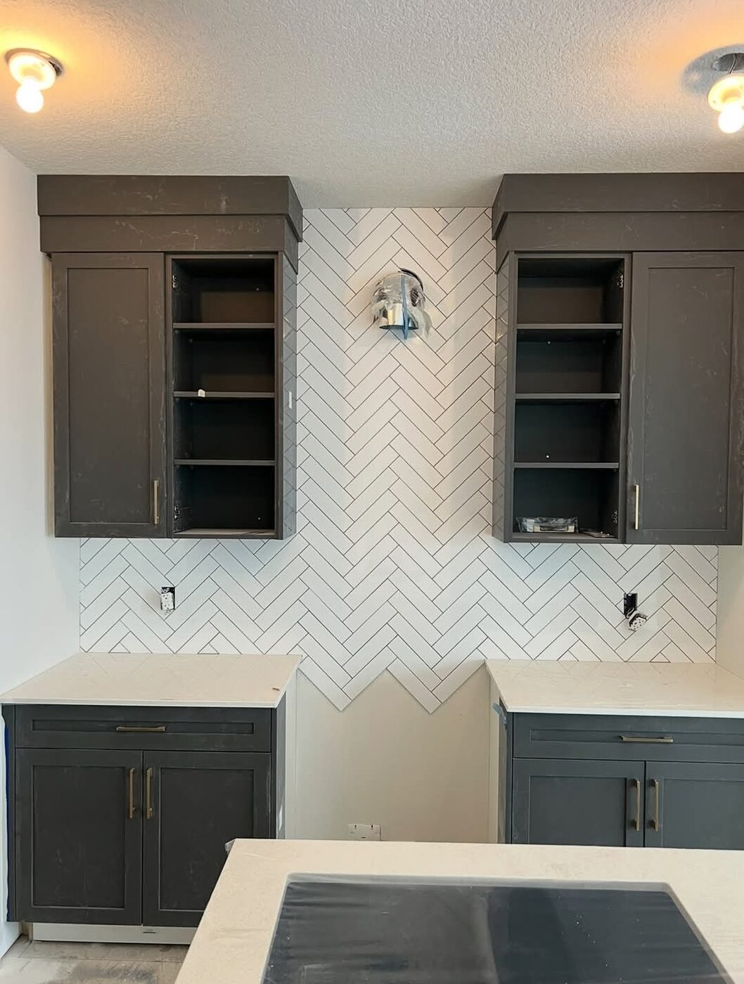 Ceramic Service Professional — Kitchen backsplash tiled in white herringbone