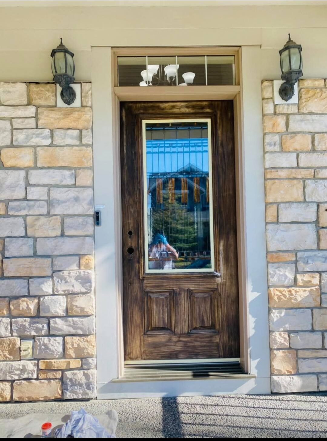 Euro Brothers Painting Calgary — Front entry door refinished in a wood-grain stain