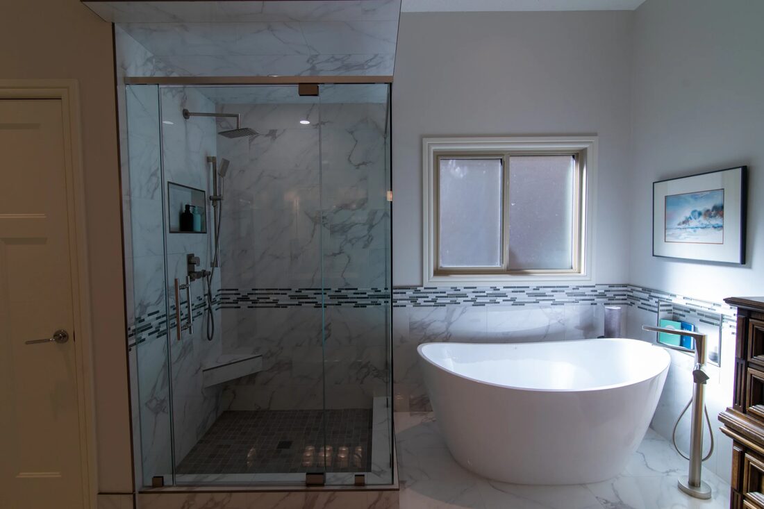 Versatile Renovations — Glass shower & soaker tub
