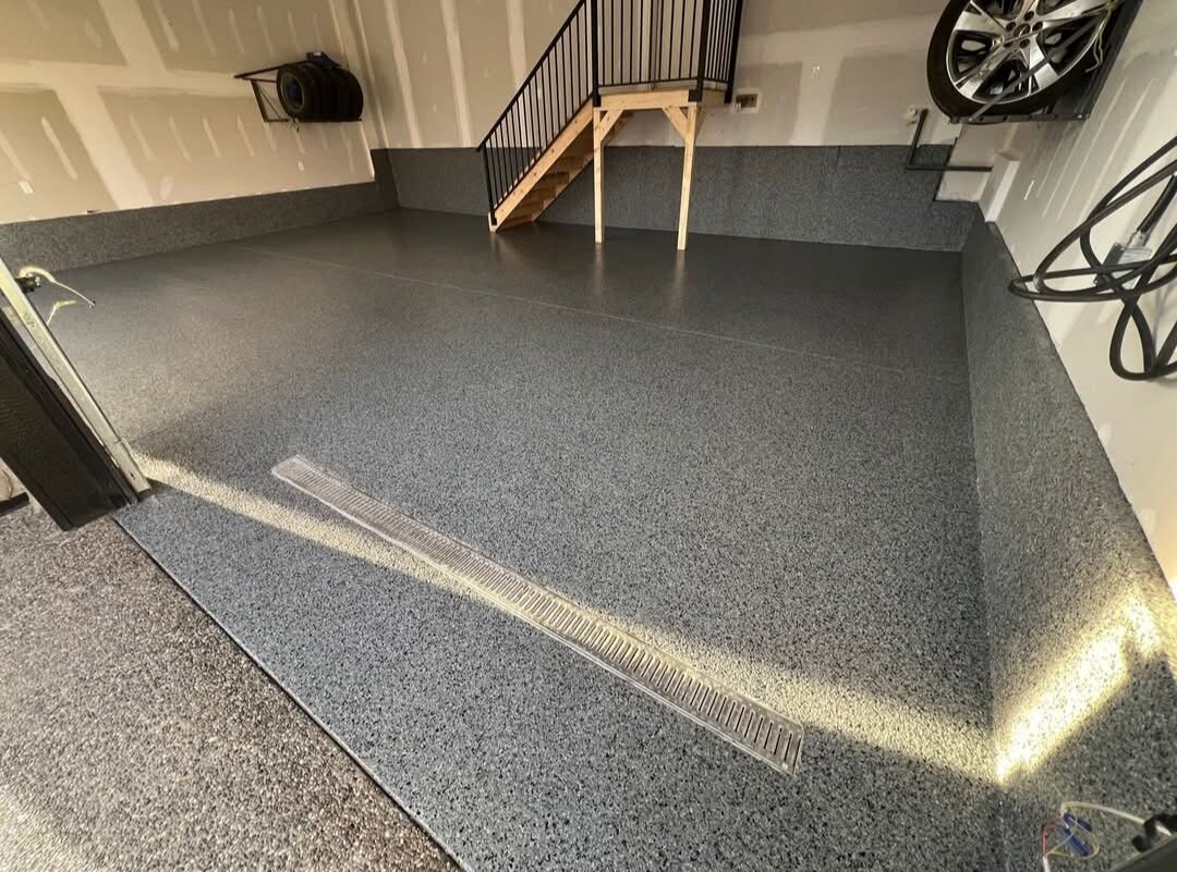 Shark Epoxy Calgary — after: Before & after: bare concrete garage transformed with a decorative epoxy flake floor coating