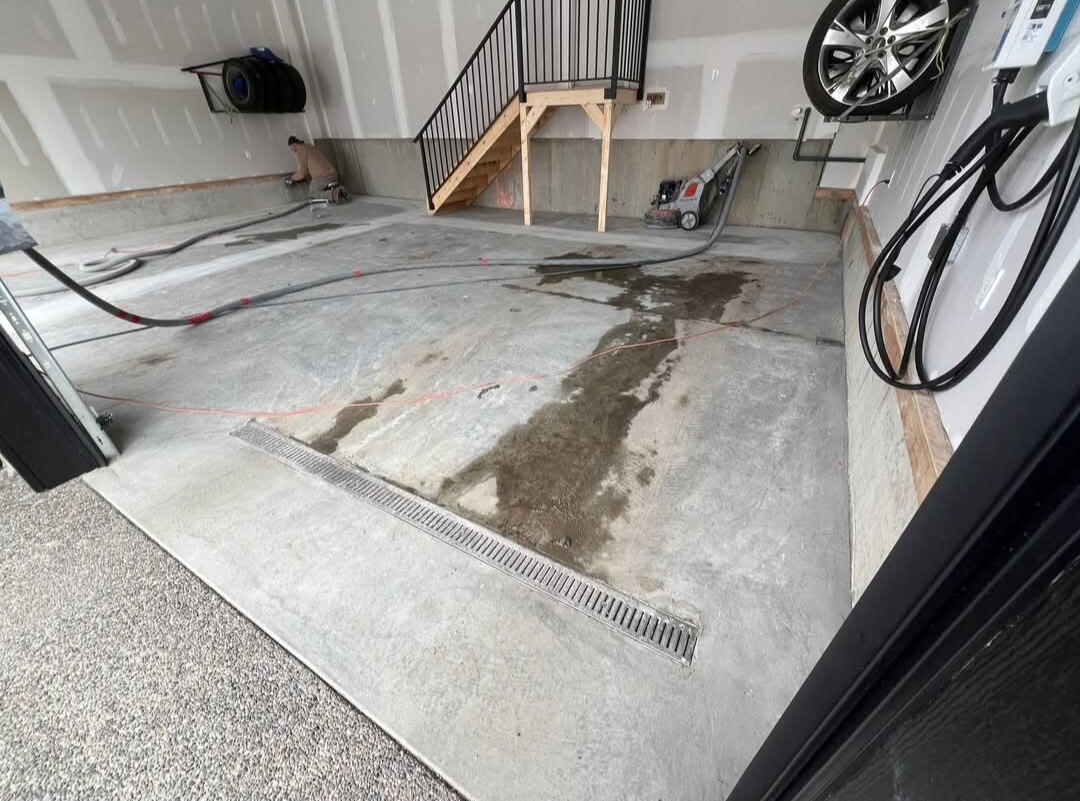 Shark Epoxy Calgary — before: Before & after: bare concrete garage transformed with a decorative epoxy flake floor coating