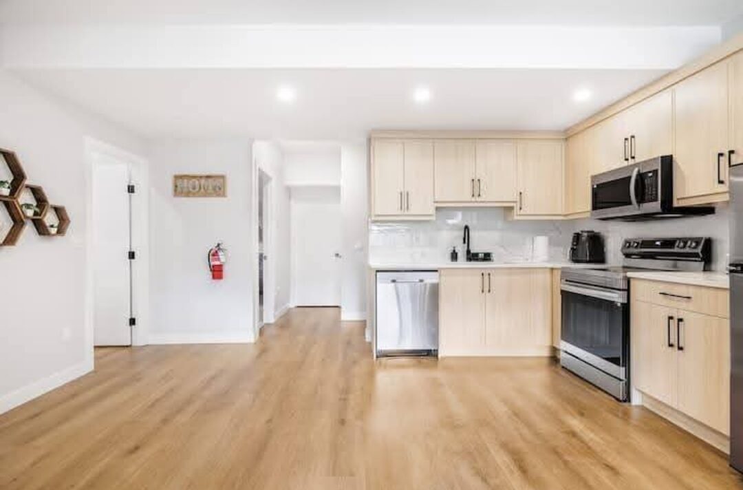 EliteCity Construction Ltd. — Basement development: open-concept kitchen and living area