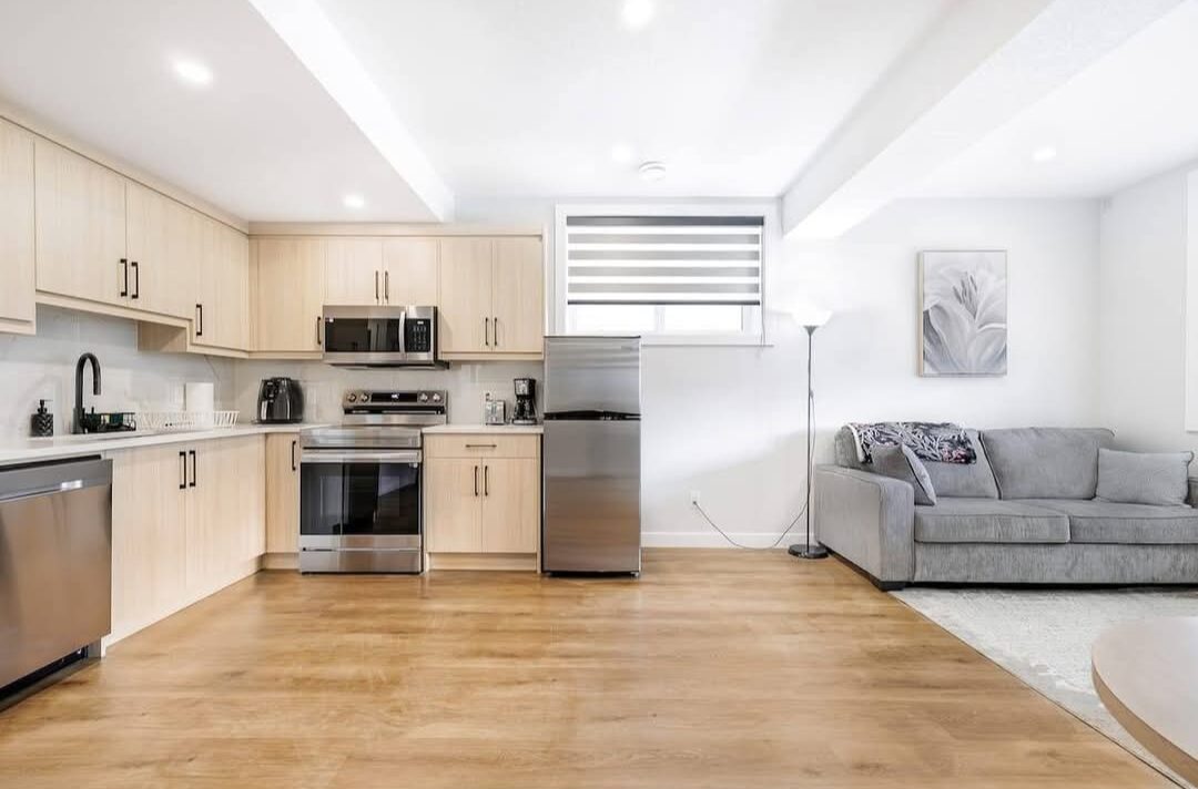 EliteCity Construction Ltd. — Finished basement suite kitchen and living room