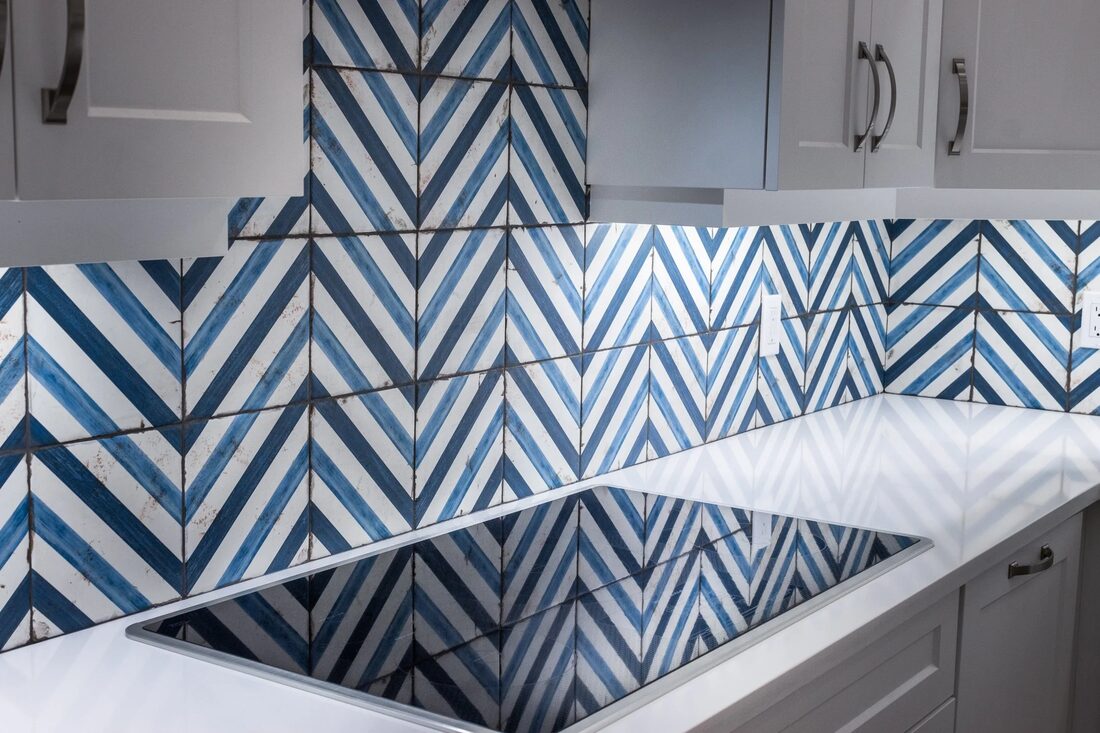 North Ridge Renovations Inc. — Chevron-tile bathroom