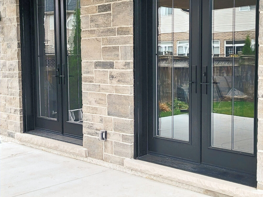 Ancaster Contracting Co. — Stone facade & patio doors