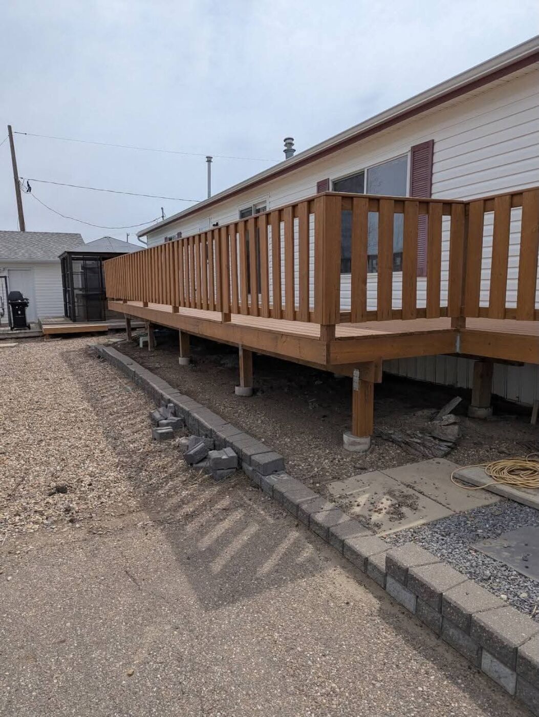 Done Right Renovations — Full-length deck build along home exterior