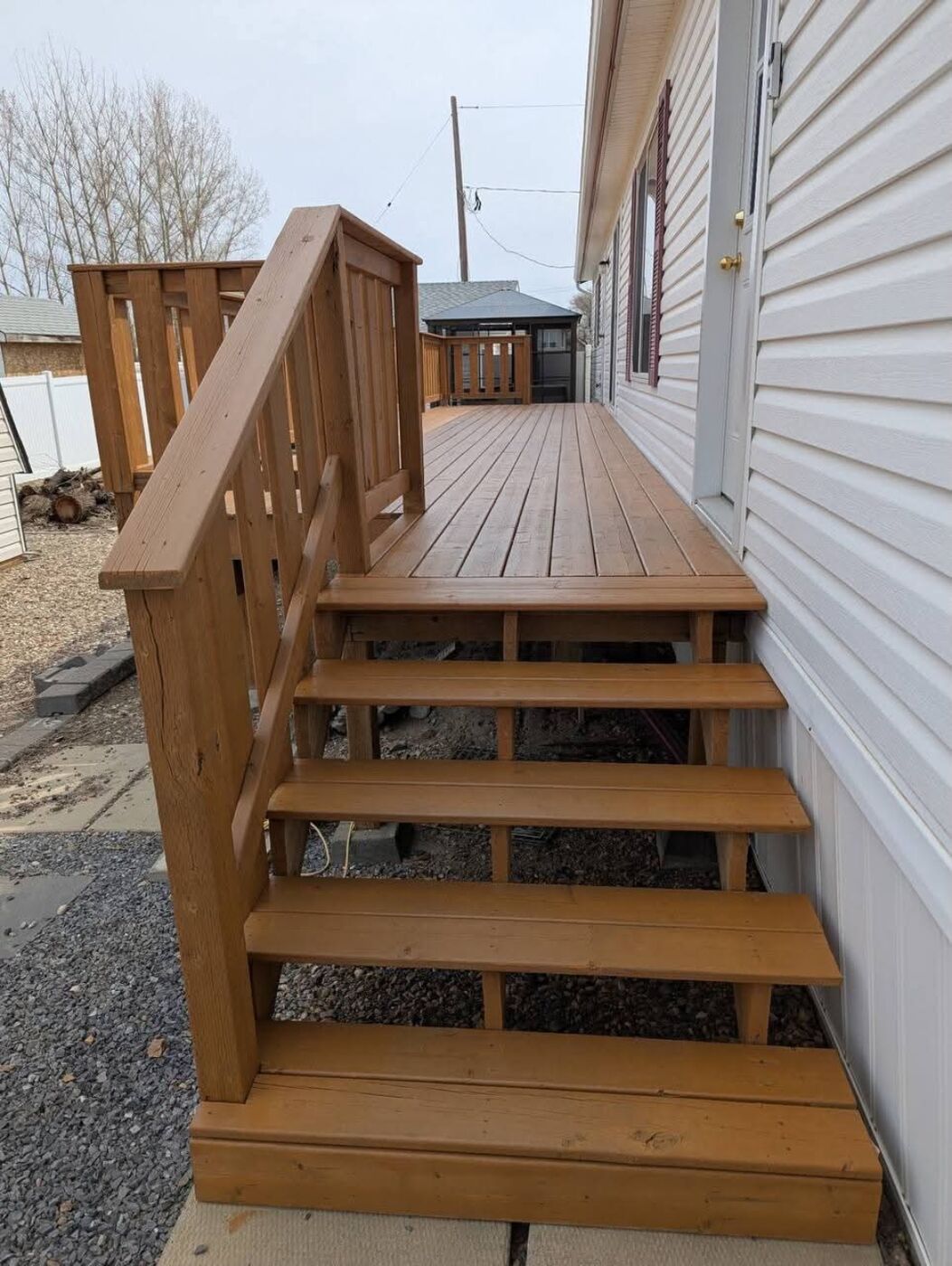 Done Right Renovations — Deck stairs with handrail detail
