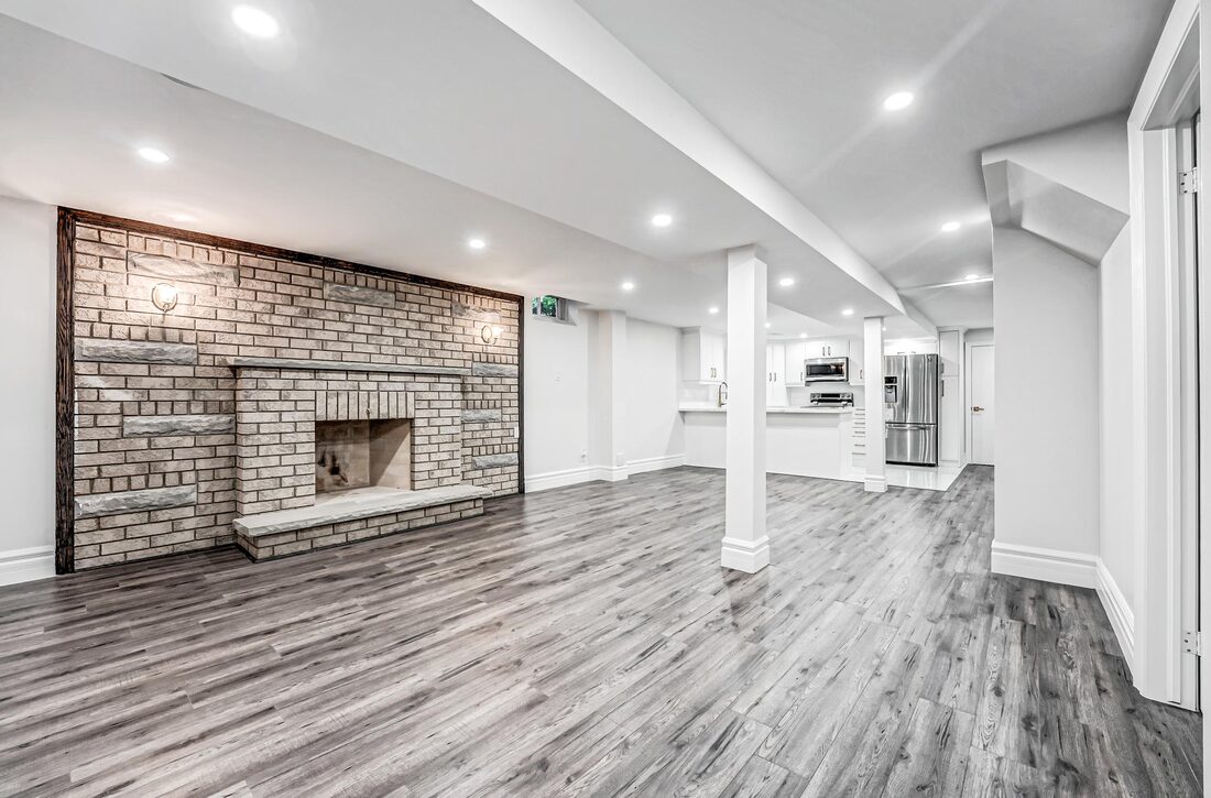 SHAM CONTRACTING & RENOVATIONS INC. — Finished basement with fireplace