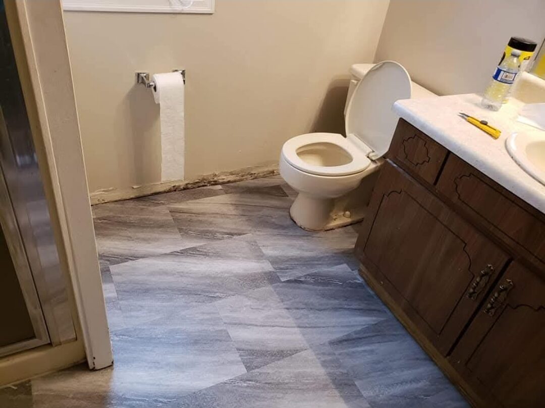 Garret's Handyman & Renovation Services — Bathroom floor finished with new vinyl plank flooring