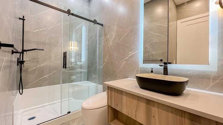 Merit Homes — Ensuite with glass shower and stone vessel sink