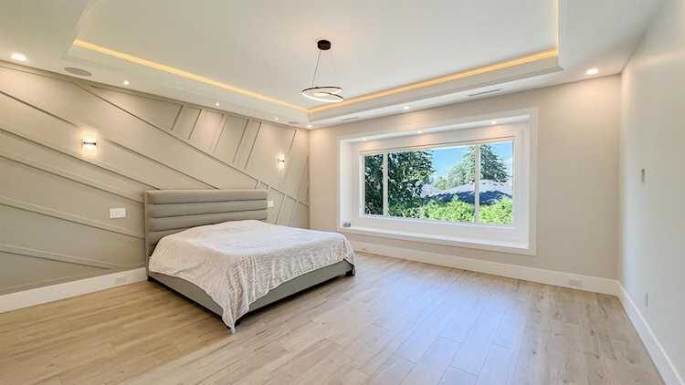Merit Homes — Master bedroom with feature wall