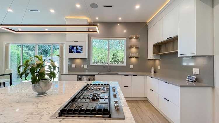 Merit Homes — Kitchen island with gas cooktop