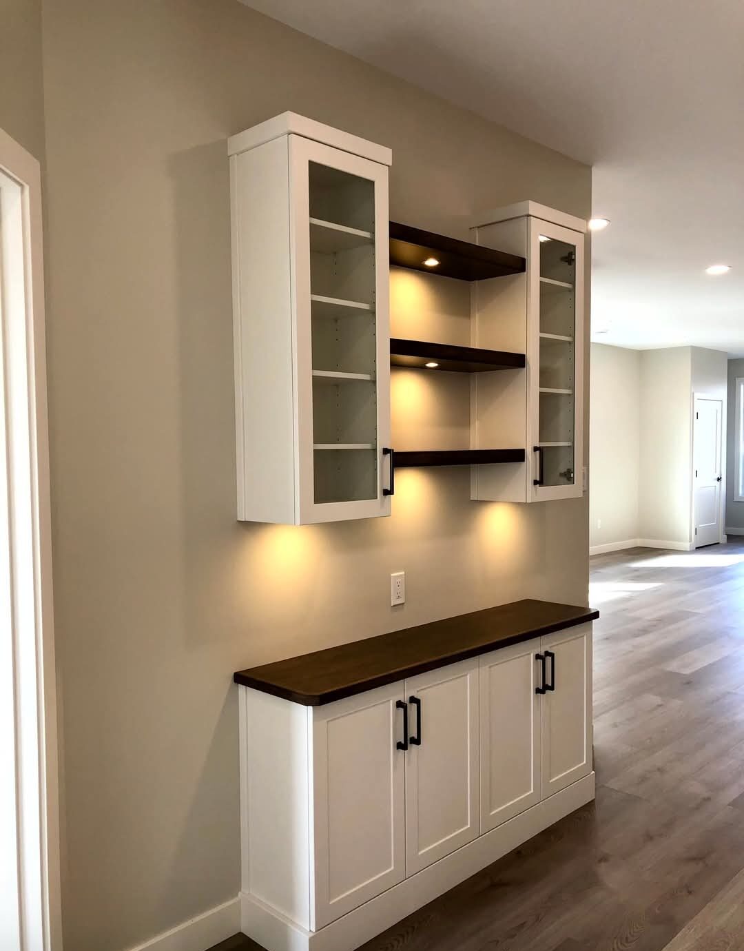 Genica Custom Builders — Built-in display cabinetry with floating shelves and buffet