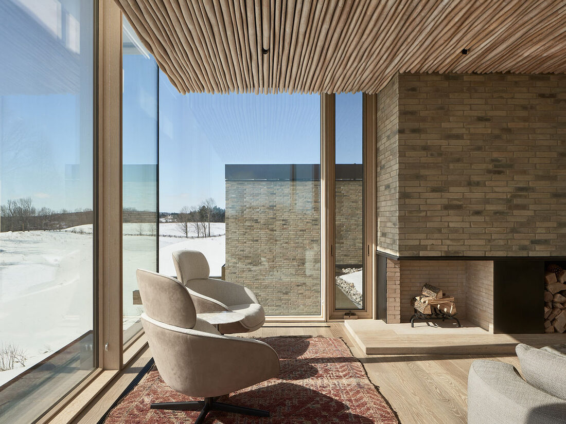 MDK Construction, Ltd. — Living room with wood ceiling and fireplace