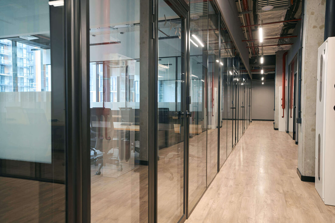 Crystal Lake Glass — Glass-walled office corridor