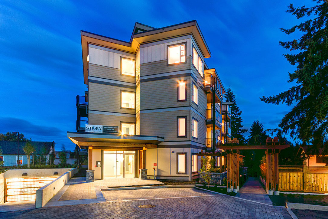 Story Construction Management Contractor — Modern home at dusk