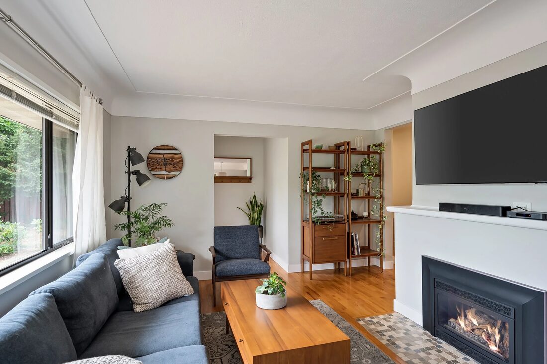 BC Home Builders — Living room with fireplace